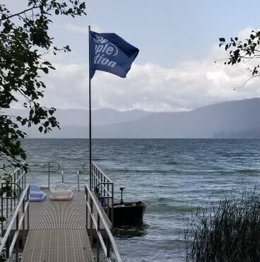 People in Motion flag at Cedar Creek dock